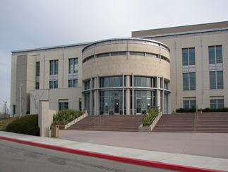 Southwest Justice Center framed by manicured bushes